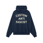 Custom Anti-Fascist Hoodie with CUSTOM ANTI FASCIST in cream letters across the front, designed for personalization and activ