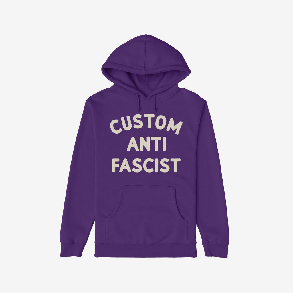Custom Anti-Fascist Hoodie with CUSTOM ANTI FASCIST in cream ink on the front, featuring a kangaroo pocket and drawstring hood, ideal for those expressing activist values through clothing.