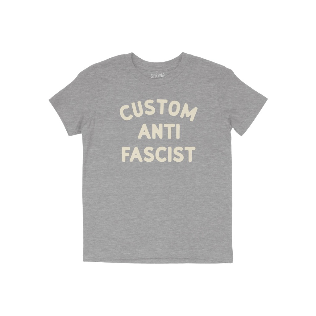 Custom Anti-Fascist Kids T-shirt featuring bold, off-white block letters on a heather-gray tee. The shirt has a crew neckline