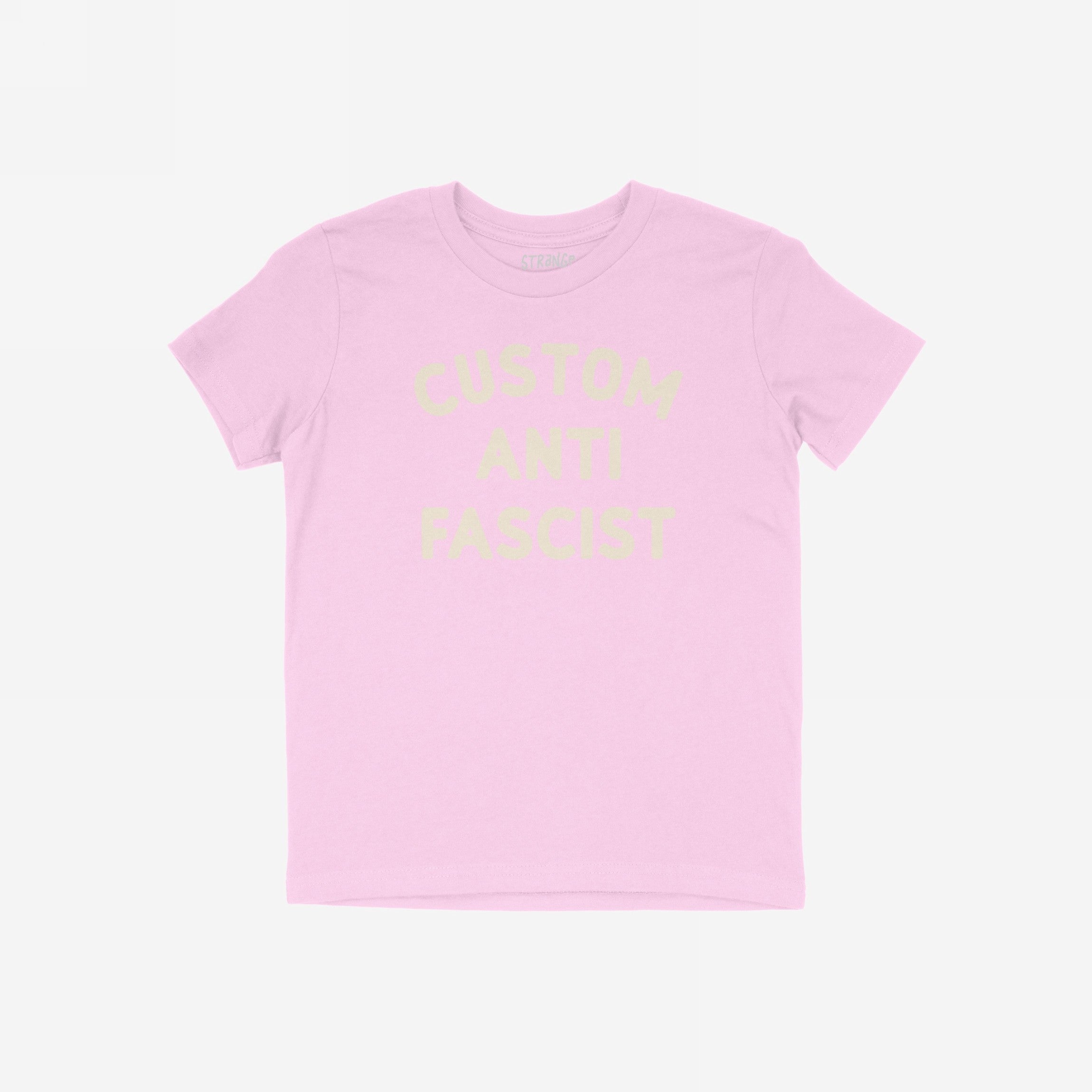 Custom Anti-Fascist Kids T-shirt featuring Custom Anti Fascist in cream ink. The light pink tee is perfect for young activists to express their beliefs in a comfortable, durable style.