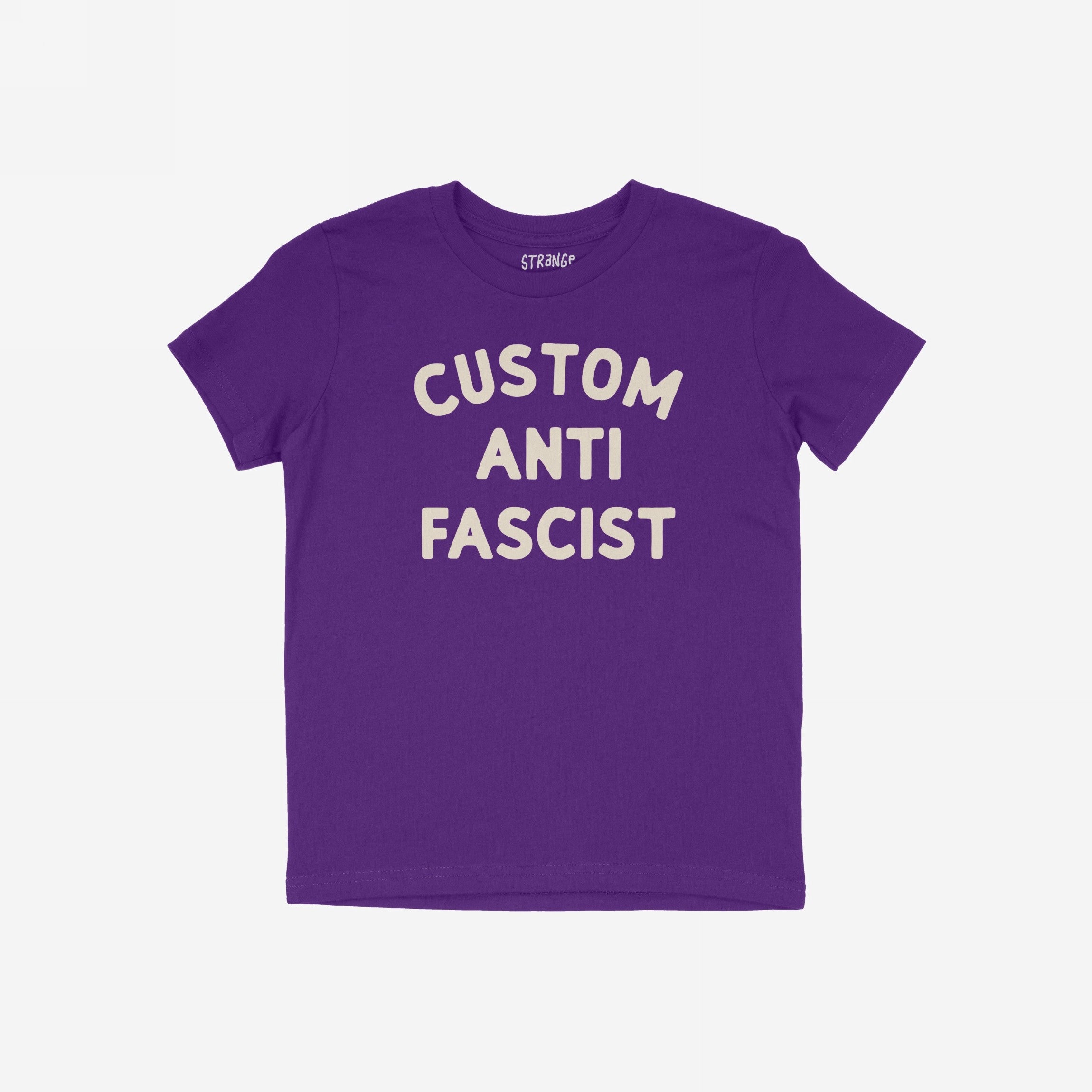 Custom Anti-Fascist Kids T-shirt featuring bold off-white block letters, laid flat. Personalize the Custom part to reflect meaningful words, promoting activism and empowerment for young voices in durable, comfortable fabric.