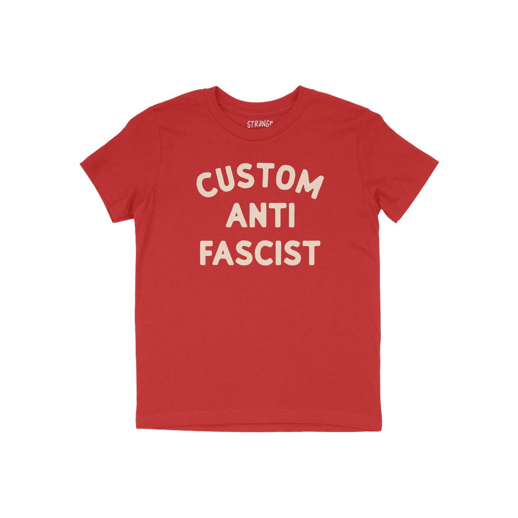 Custom Anti-Fascist Kids T-shirt featuring bold, off-white CUSTOM ANTI FASCIST text on a red short-sleeve. Ideal for young ac