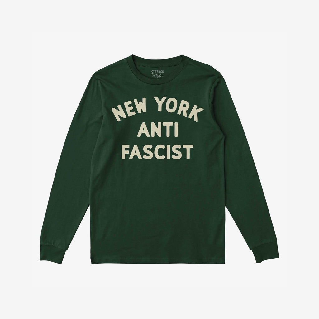 Custom Anti-Fascist Long Sleeve T-shirt with NEW YORK ANTI FASCIST in off-white block letters, designed for activism and personal expression, laid flat on a white background.