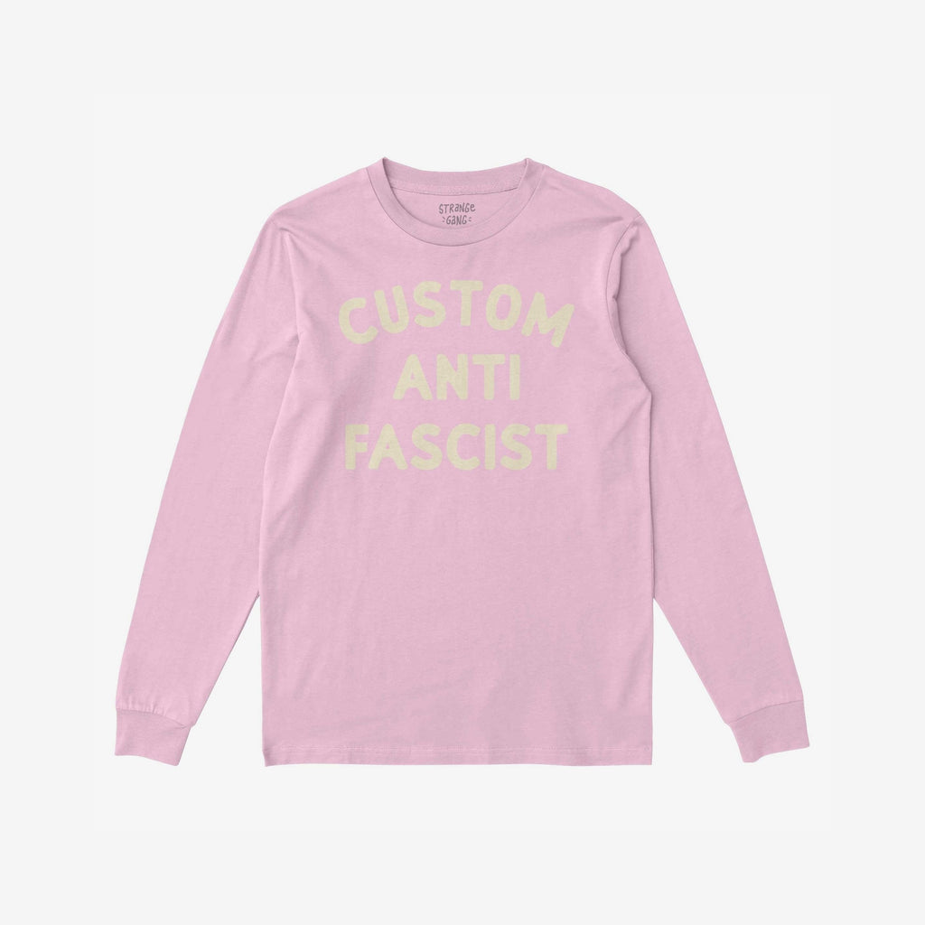 Custom Anti-Fascist Long Sleeve T-shirt with CUSTOM ANTI FASCIST in pale yellow across the chest, offering personalizable text, laid flat showcasing a comfortable, durable design for activism and cooler days.