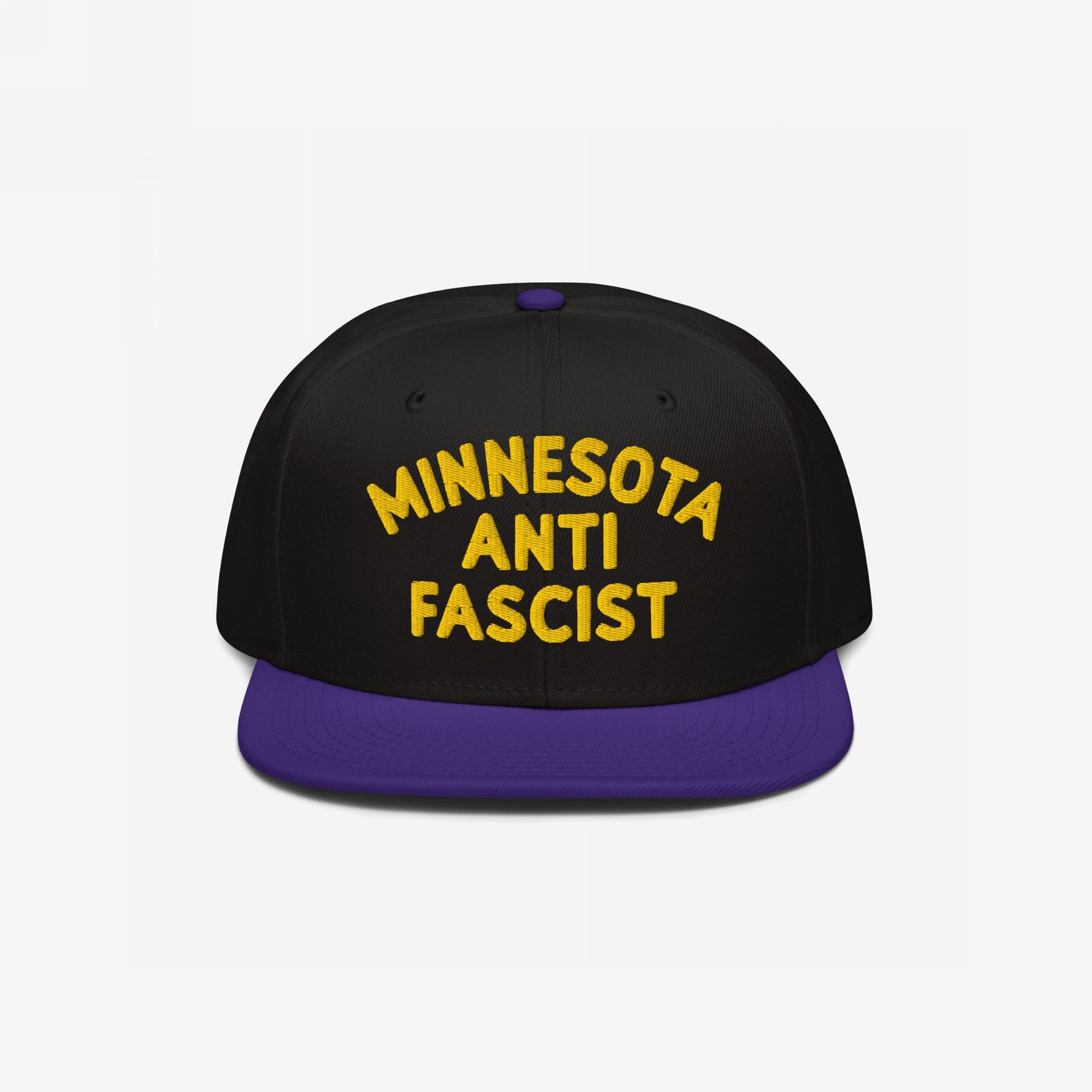 Custom Anti-Fascist Snapback Hat featuring bold yellow MINNESOTA ANTI FASCIST embroidery on the front. Black crown, purple flat brim, adjustable closure, promoting equality and anti-fascism with customizable city or community text.
