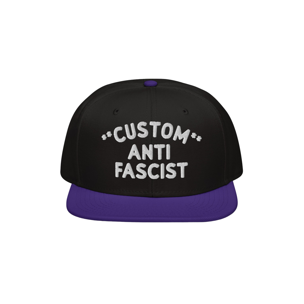 Custom Anti-Fascist Snapback Hat with a black crown and deep purple brim, featuring bold white embroidery that reads CUSTOM A