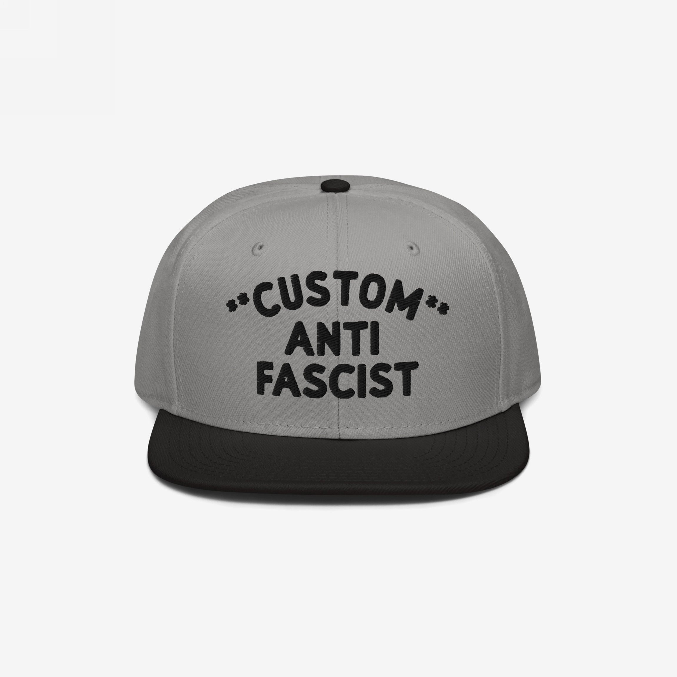 Custom Anti-Fascist Snapback Hat, featuring a bold CUSTOM ANTI FASCIST embroidery on the front, offering personalization for a unique anti-fascist statement with adjustable fit and structured design.