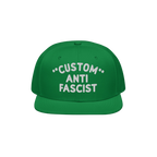 Green flat-bill cap with CUSTOM ANTI FASCIST embroidered in white. The Custom Anti-Fascist Snapback Hat offers personalizatio