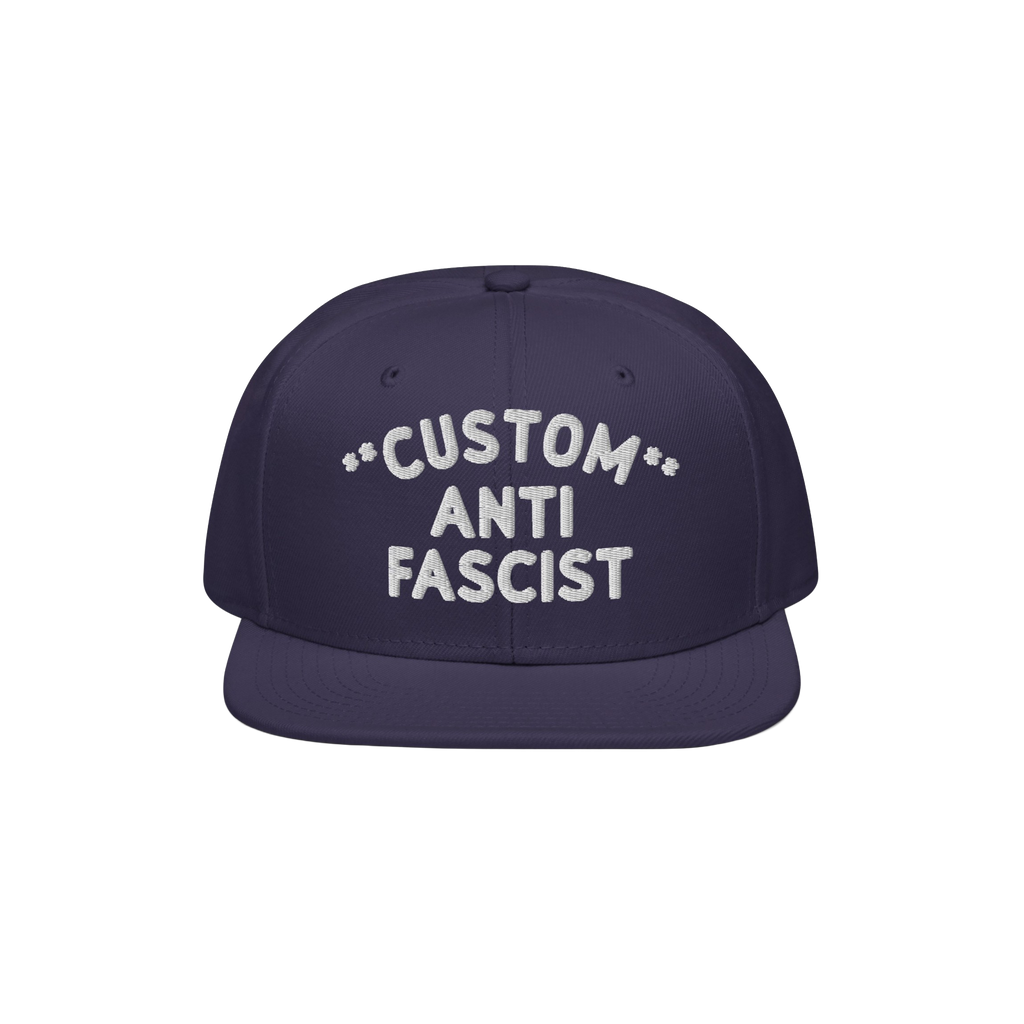 Custom Anti-Fascist Snapback Hat featuring a navy flat-brim design with bold white embroidery. The adjustable snapback offers