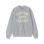 Custom Anti-Fascist Sweatshirt featuring bold cream text, highlighting personal values. Midweight crewneck design ideal for p