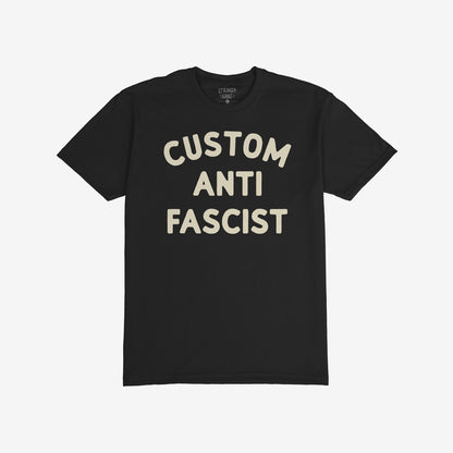Custom Anti-Fascist T-shirt featuring bold off-white text CUSTOM ANTI FASCIST on a black background, embodying activism and comfort, ideal for expressing anti-fascist views in everyday wear.