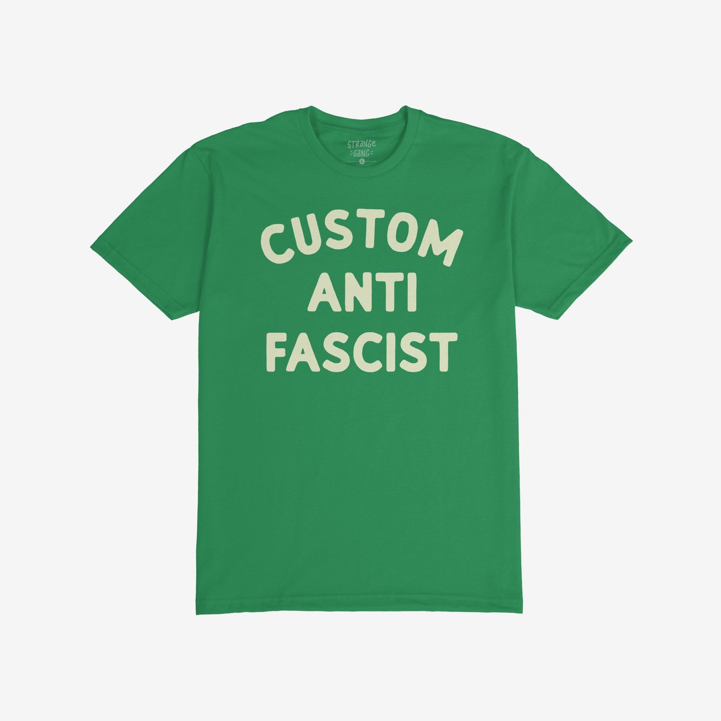 Custom Anti-Fascist T-shirt featuring bold, cream-colored text reading CUSTOM ANTI FASCIST on a green T-shirt. Personalize the top line to reflect your activism, promoting equality and anti-fascism.