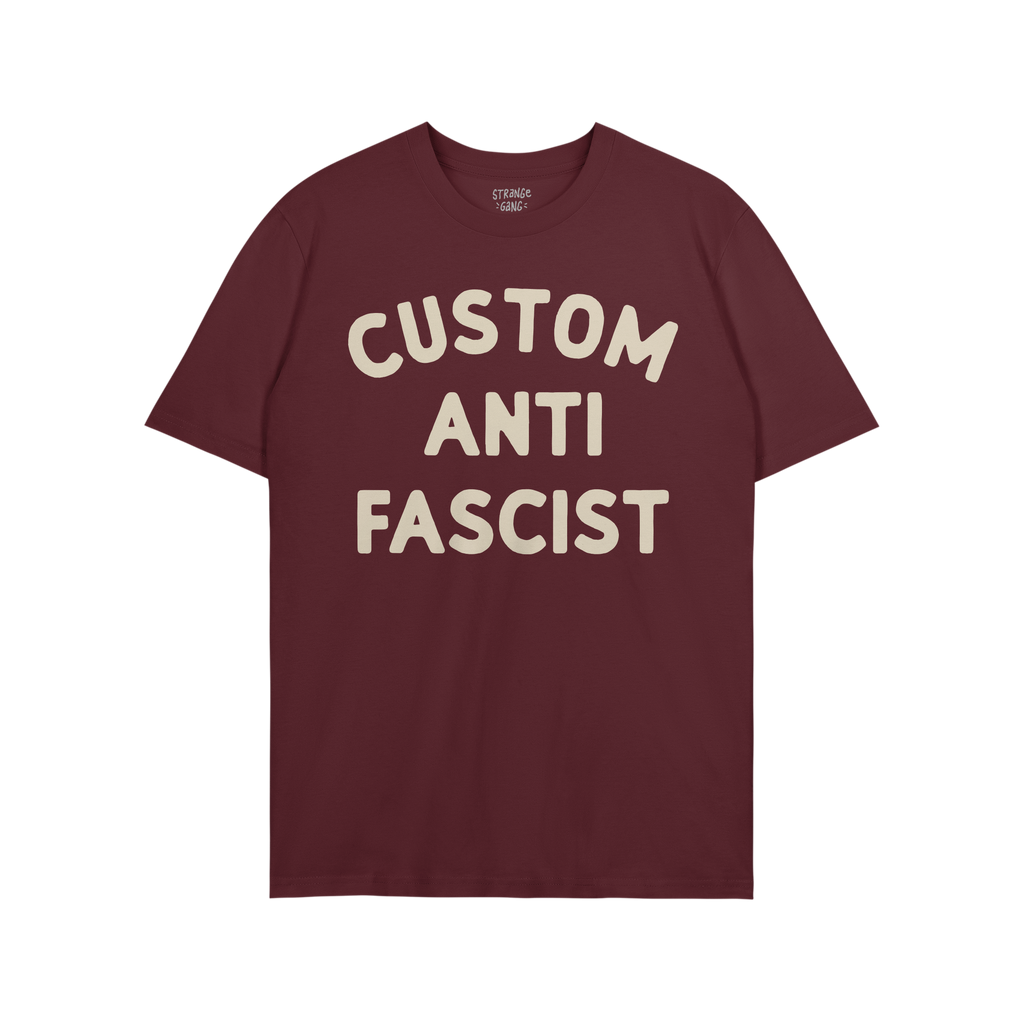 Custom Anti-Fascist T-shirt featuring bold cream text CUSTOM ANTI FASCIST on a maroon crew-neck, embodying a strong anti-fasc