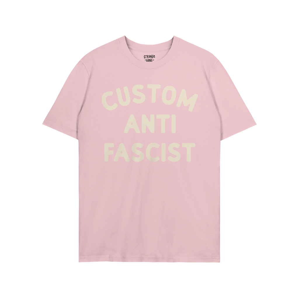 Light pink Custom Anti-Fascist T-shirt with bold off-white text on the chest, designed for personalization, promoting anti-fa