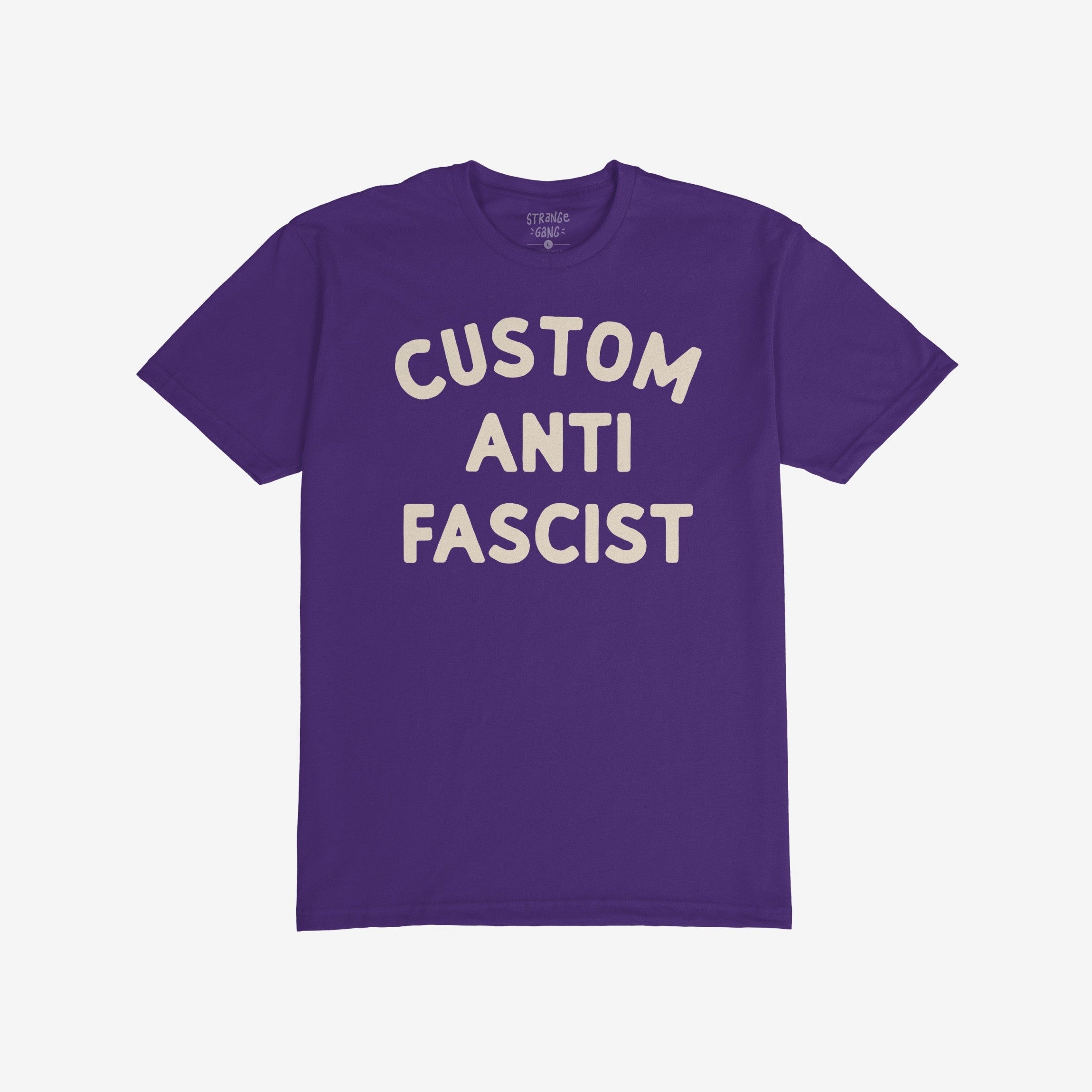 Custom Anti-Fascist T-shirt featuring bold off-white text on a purple background. The shirt encourages personalized activism through the customizable Custom line, combining comfort and a strong anti-fascism message.