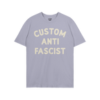 Custom Anti-Fascist T-shirt featuring bold off-white text on a purple background. The shirt encourages personalized activism 