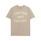 Light tan Custom Anti-Fascist T-shirt with bold off-white block lettering, allowing personalization of the Custom text; perfe