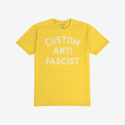 Custom Anti-Fascist T-shirt with bold white letters on the chest, laid flat showing the words CUSTOM ANTI FASCIST, highlighting activism through customizable text for personal expression against fascism.