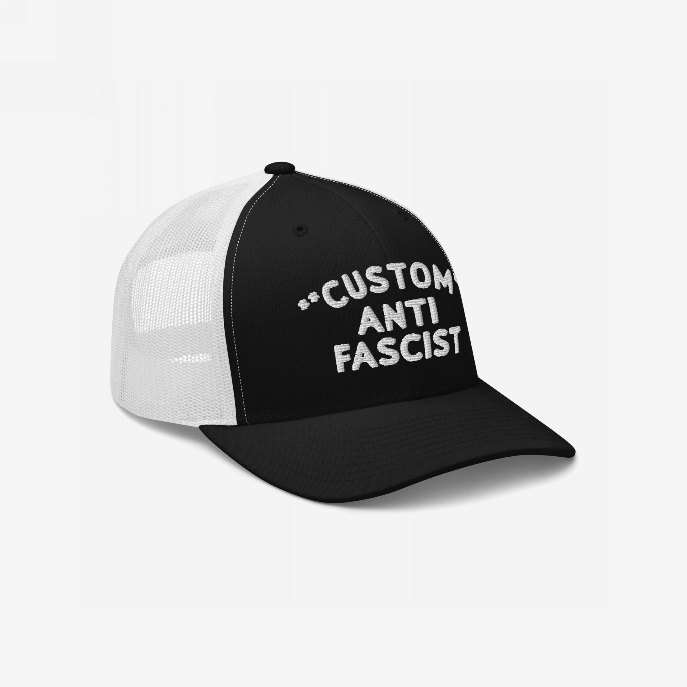 Custom Anti-Fascist Trucker Hat with mesh back, featuring bold CUSTOM ANTI FASCIST embroidery on the front. Personalizable text promotes individuality and anti-fascist message, combining style and breathable comfort with adjustable fit.