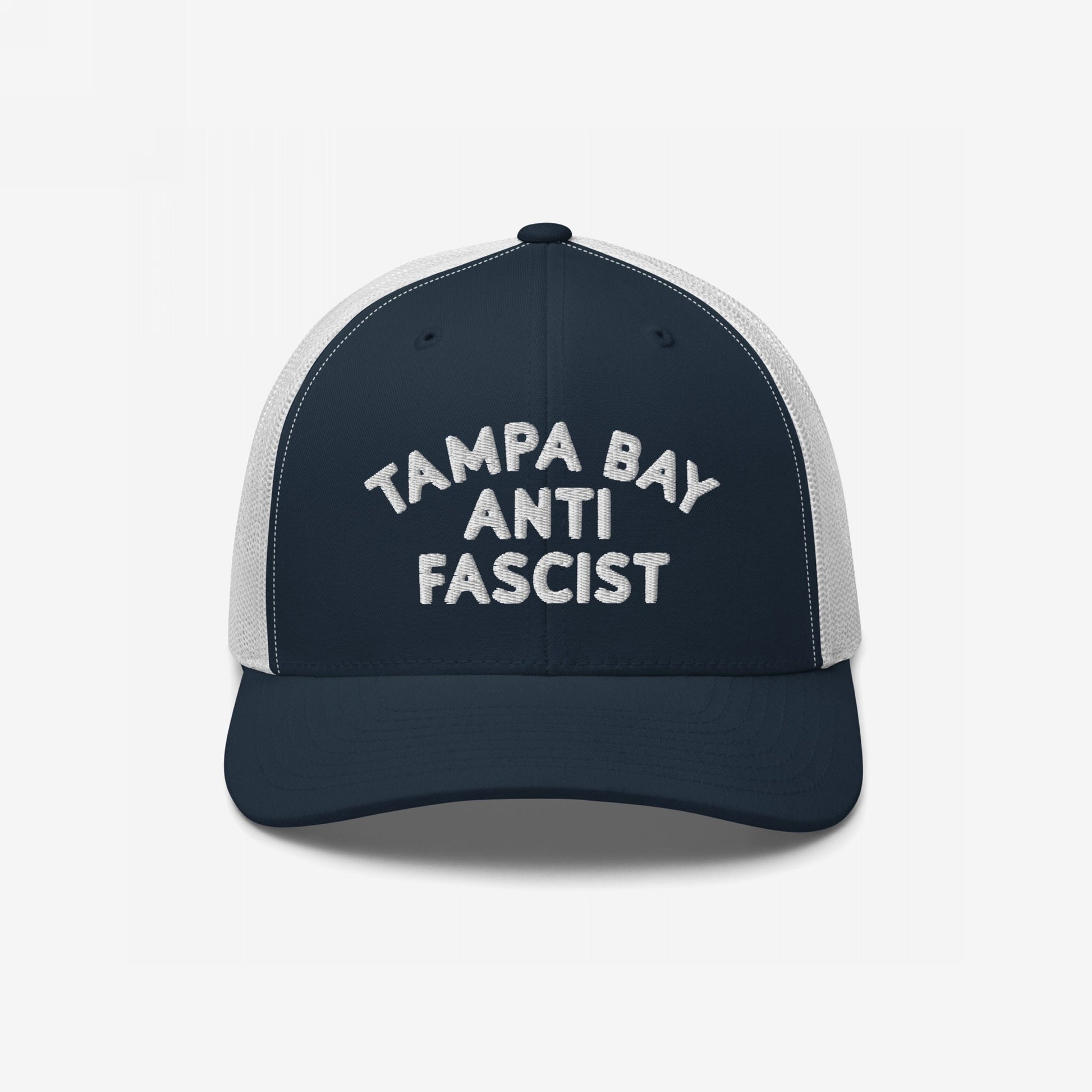 Custom Anti-Fascist Trucker Hat featuring TAMPA BAY ANTI FASCIST embroidered on a navy front with a white mesh back and adjustable snap closure, combining bold style with breathable comfort.