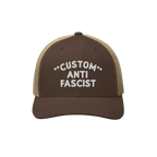 Brown-and-tan trucker cap with mesh back, featuring white embroidered CUSTOM ANTI FASCIST text, highlighting personalizable d