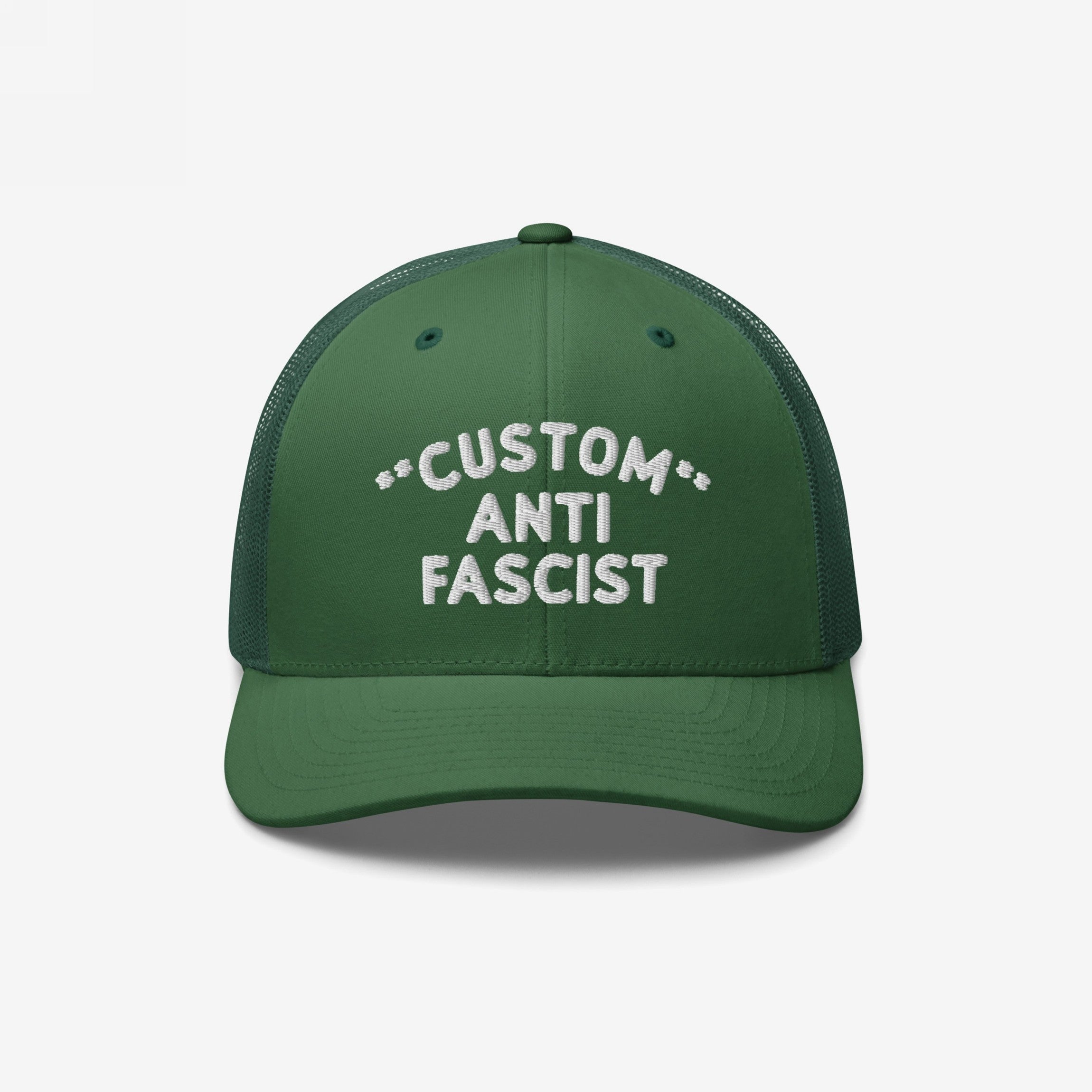 Custom Anti-Fascist Trucker Hat with dark-green front, white embroidered text, breathable mesh back, and adjustable snap closure, promoting anti-fascism. Personalize with your message for bold, comfortable expression.