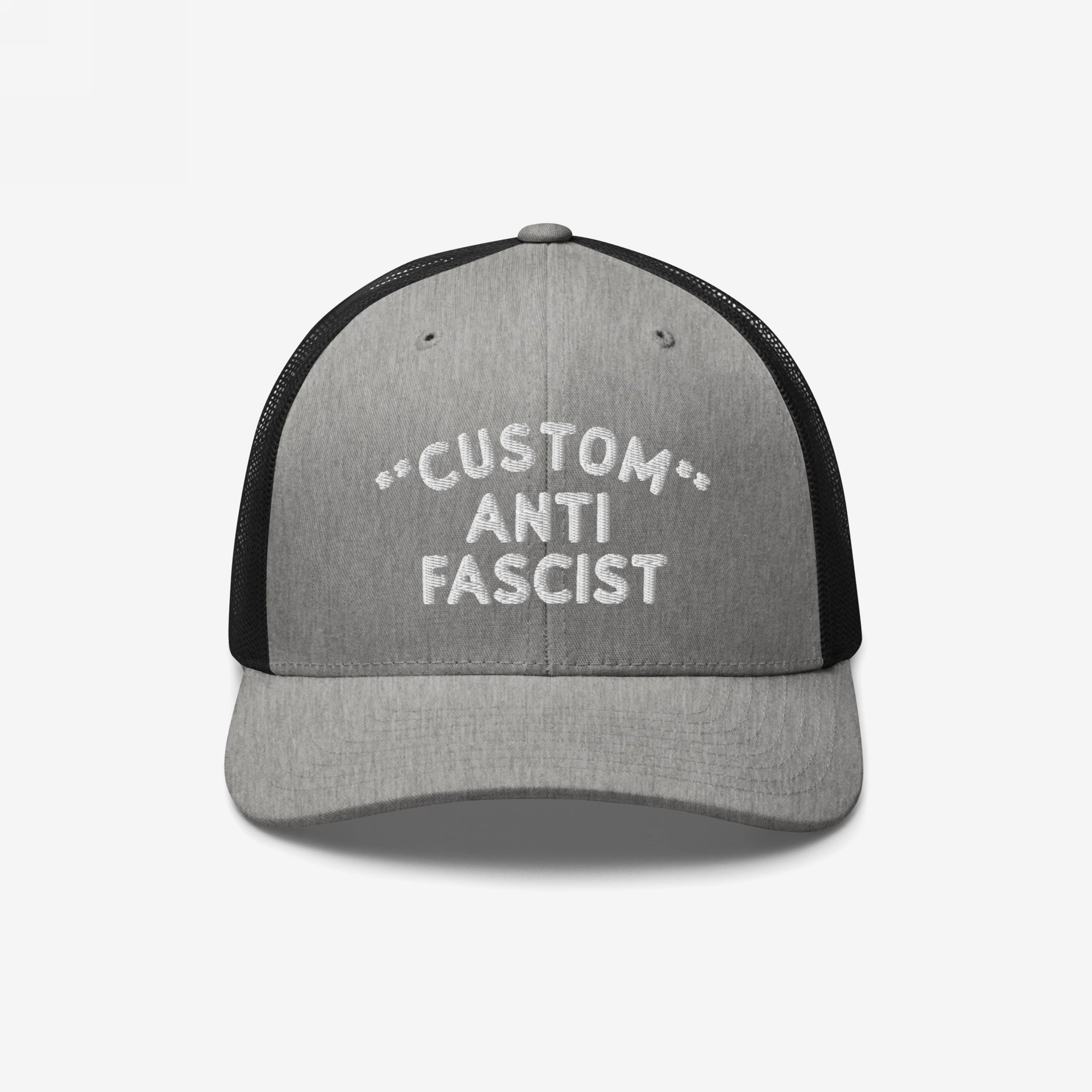 Custom Anti-Fascist Trucker Hat with light gray front, black mesh back, and white embroidered message. Features breathable mesh, adjustable snapback, and customizable text for a bold, personalized anti-fascist statement.