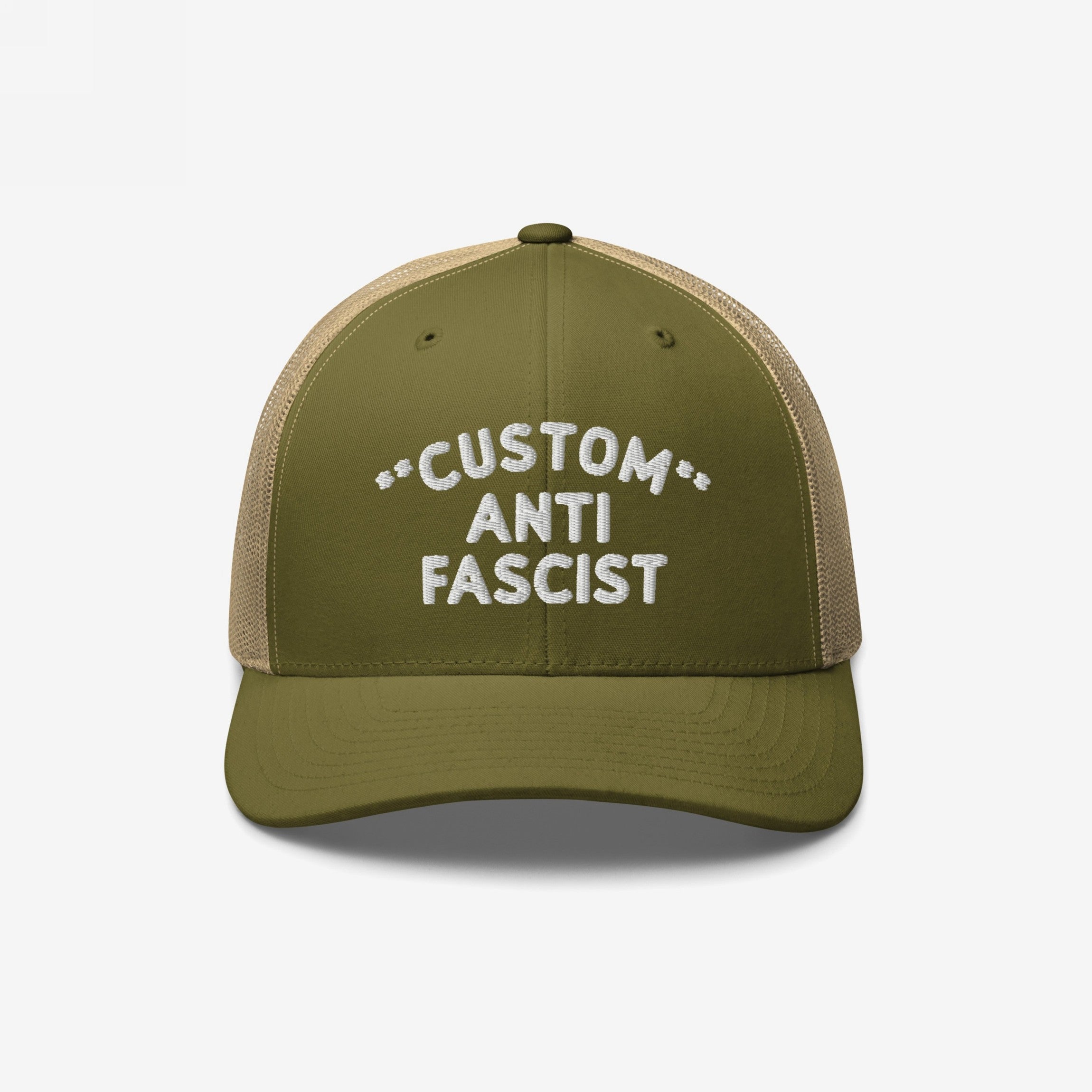 Custom Anti-Fascist Trucker Hat featuring an olive green front and tan mesh back. Embroidered CUSTOM ANTI FASCIST text, adjustable snap closure, highlighting an anti-fascist message with customizable options.