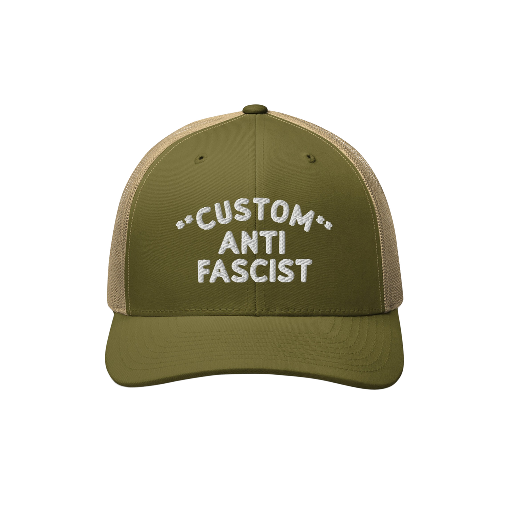 Custom Anti-Fascist Trucker Hat featuring an olive green front and tan mesh back. Embroidered CUSTOM ANTI FASCIST text, adjus