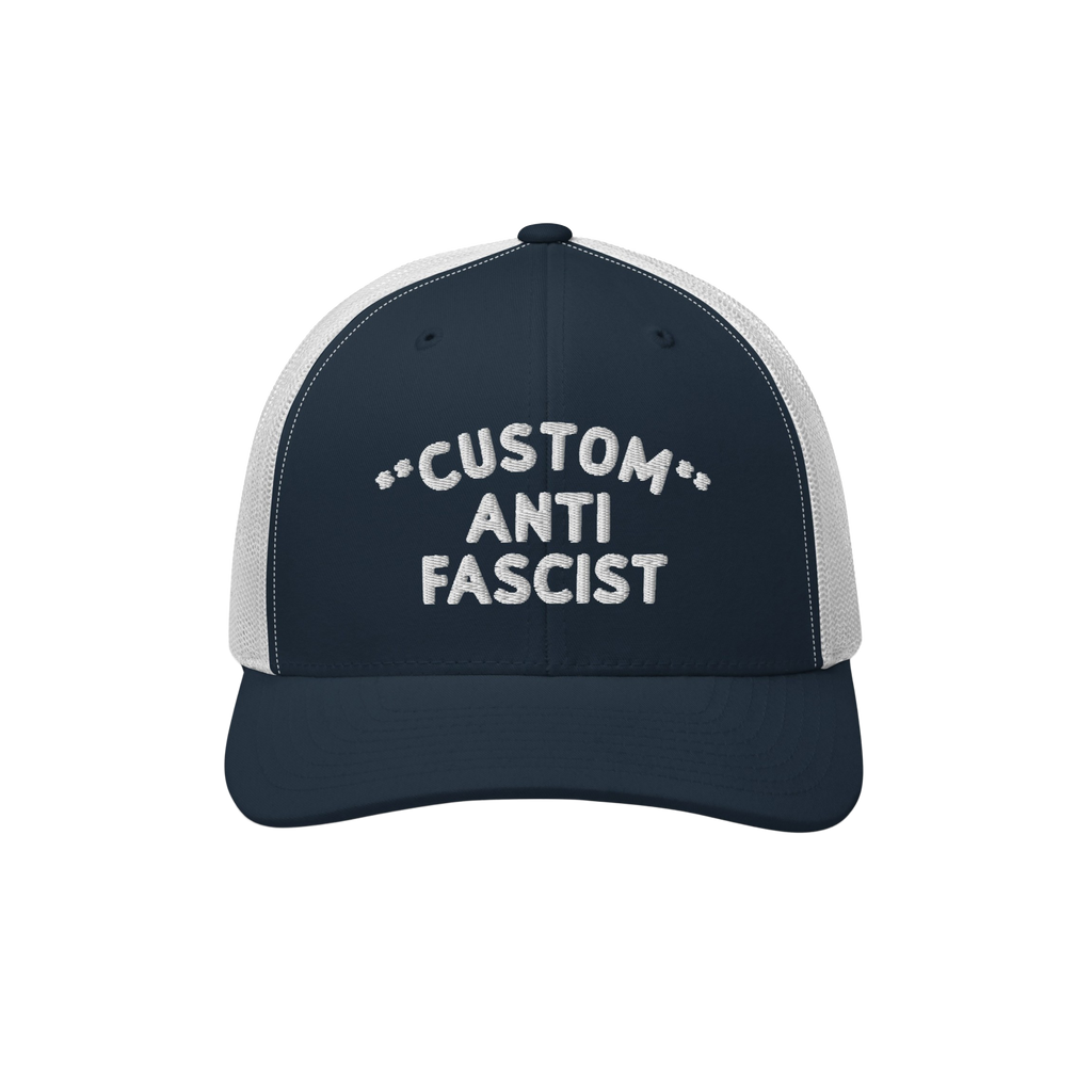 Custom Anti-Fascist Trucker Hat with navy front and white mesh back, featuring CUSTOM ANTI FASCIST embroidered text. Personal