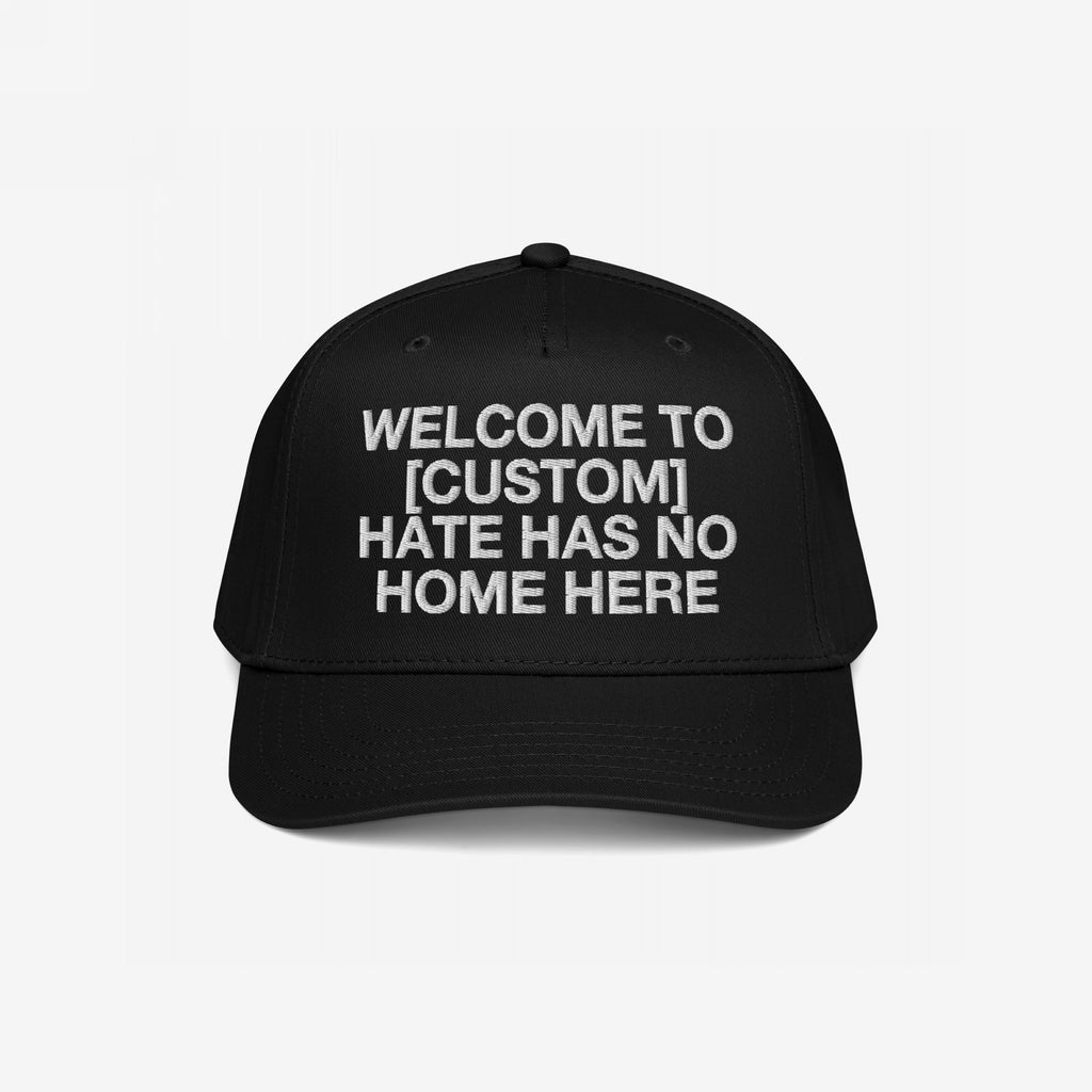 Custom Hate Has No Home Here 5-Panel Hat with bold white embroidery promoting unity and inclusion. Features adjustable snapback closure and breathable eyelets, perfect for advocating justice and anti-hate values.
