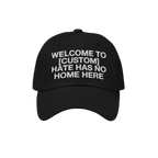 Custom Hate Has No Home Here Dad Hat features a black cap with white embroidered text promoting inclusion. Personalize with y