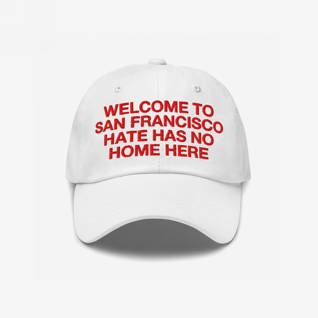 Custom Hate Has No Home Here Dad Hat featuring red embroidered text WELCOME TO SAN FRANCISCO HATE HAS NO HOME HERE, promoting inclusion. Unstructured design with curved brim, adjustable strap, and subtle EGOPROOF logo.