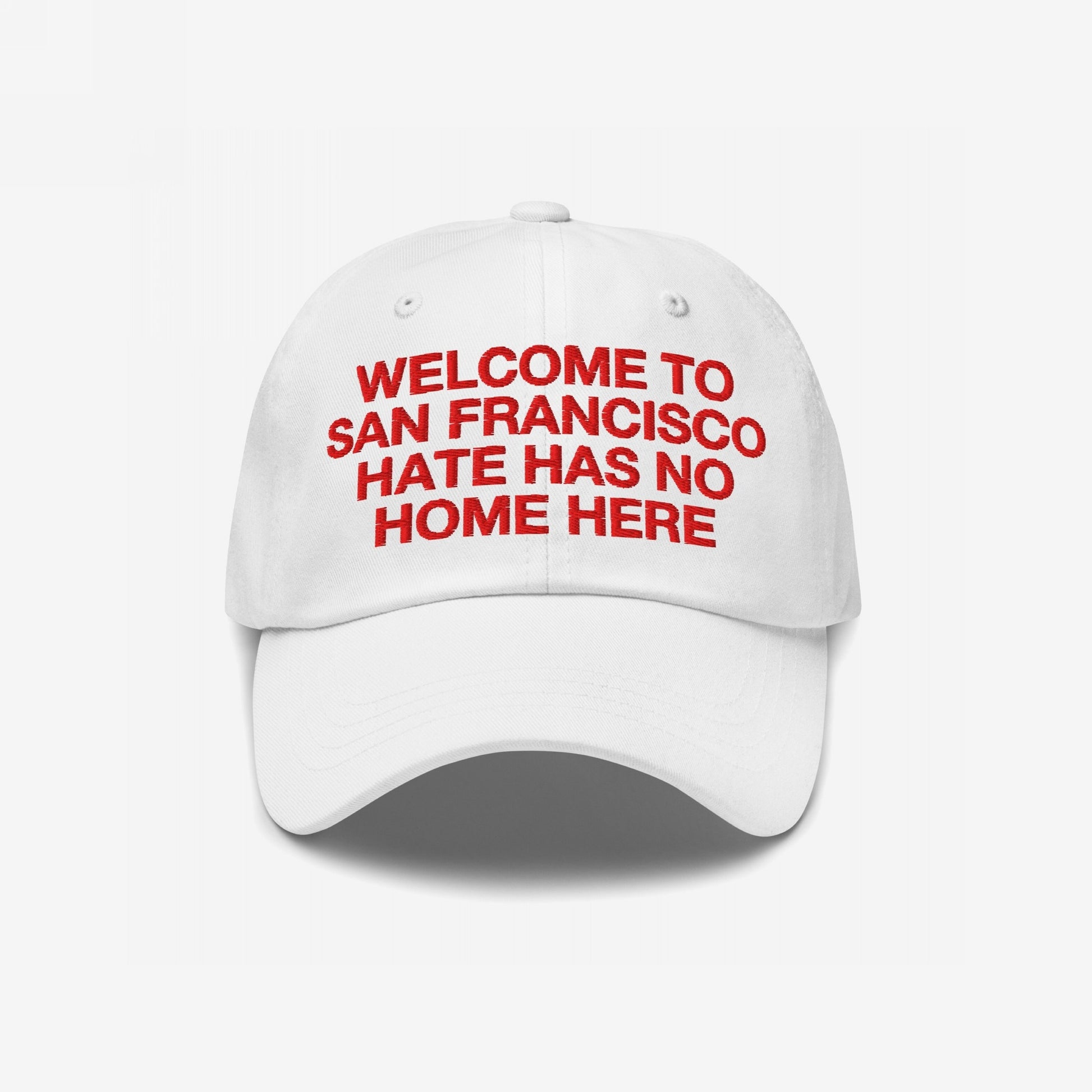 Custom Hate Has No Home Here Dad Hat featuring red embroidered text WELCOME TO SAN FRANCISCO HATE HAS NO HOME HERE, promoting inclusion. Unstructured design with curved brim, adjustable strap, and subtle EGOPROOF logo.