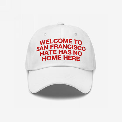 Custom Hate Has No Home Here Dad Hat featuring red embroidered text WELCOME TO SAN FRANCISCO HATE HAS NO HOME HERE, promoting inclusion. Unstructured design with curved brim, adjustable strap, and subtle EGOPROOF logo.