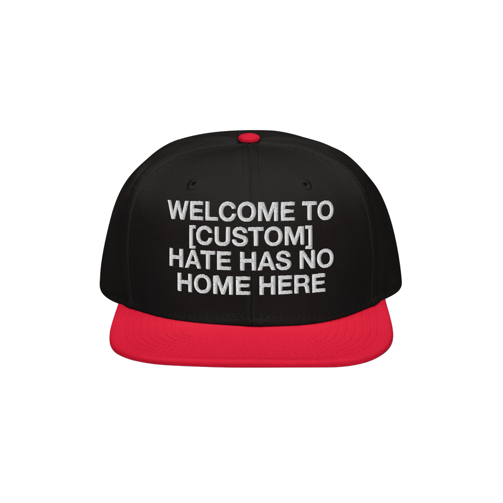 Custom Hate Has No Home Here Snapback Hat features a bold, white embroidered message promoting unity and justice, set against