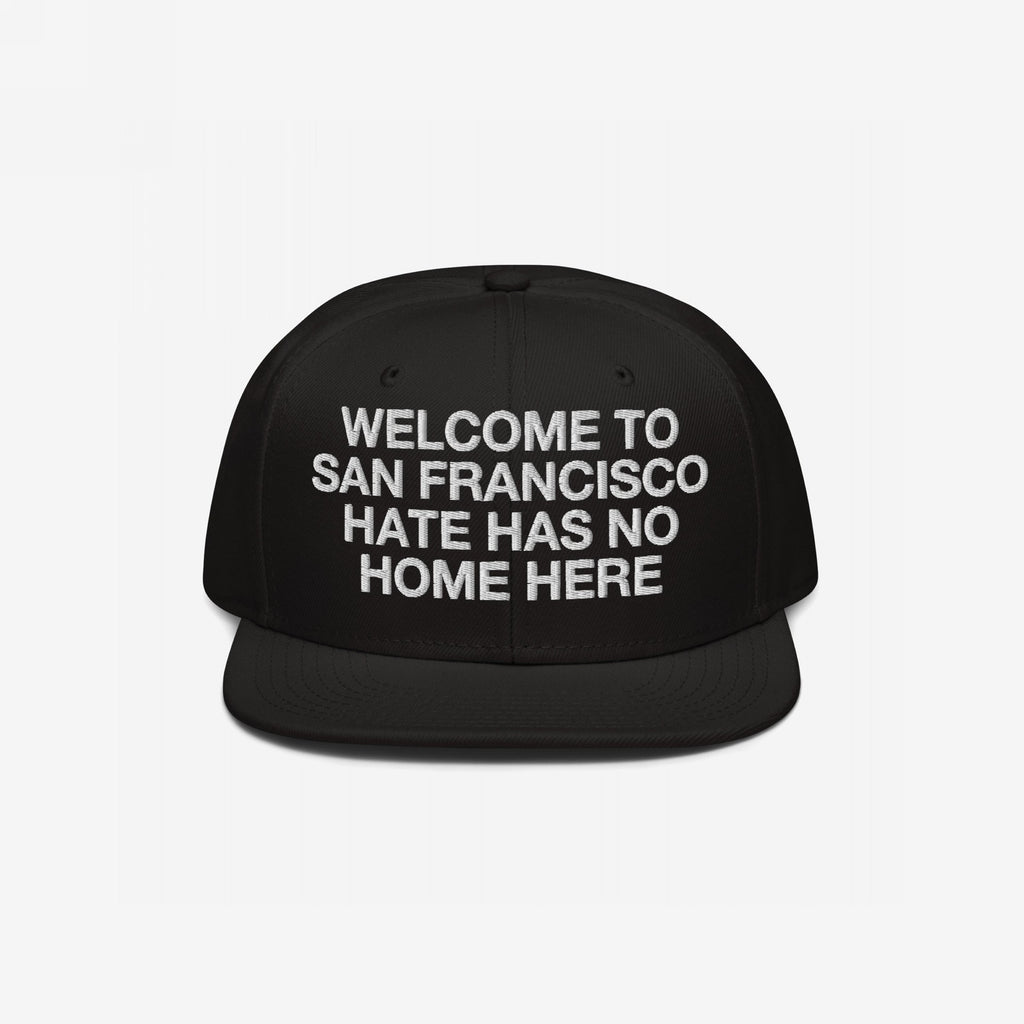 Custom Hate Has No Home Here Snapback Hat featuring bold white embroidery WELCOME TO SAN FRANCISCO HATE HAS NO HOME HERE on the front, flat brim, adjustable snap closure, and EGOPROOF logo on the back.