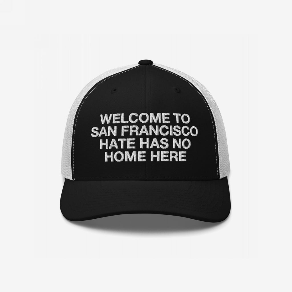 Custom Hate Has No Home Here Trucker Hat with Welcome to San Francisco message, featuring a structured front and breathable mesh back, embodies a strong stance against hate and division.