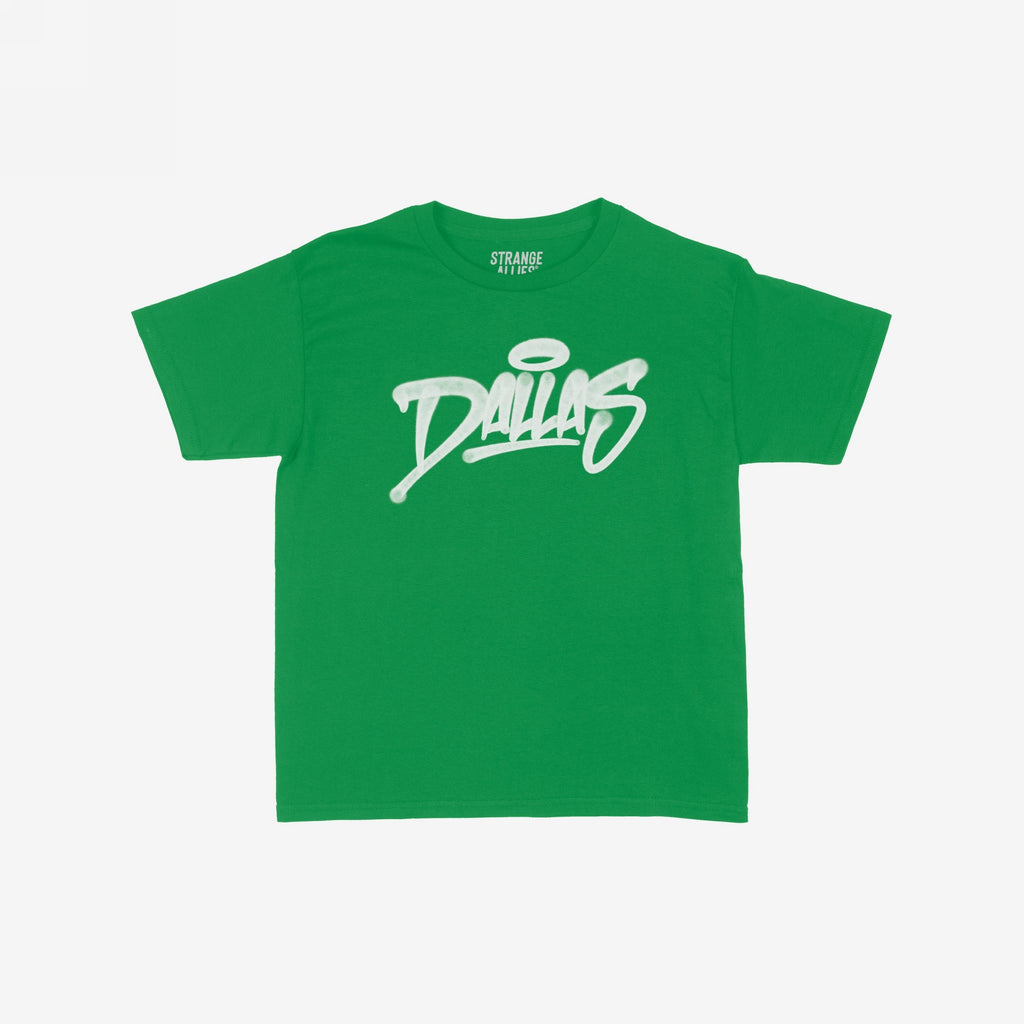 Dallas Handstyle Women's Baby Tee: A green short-sleeve tee with Dallas in white graffiti-style lettering and a halo graphic, embodying vibrant, retro energy perfect for casual outings.