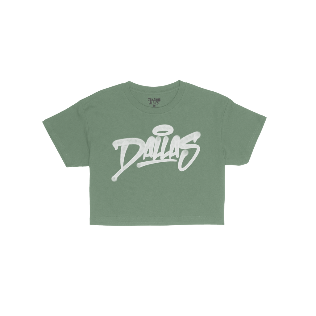 Dallas Handstyle Women's Baby Tee: A green short-sleeve tee with Dallas in white graffiti-style lettering and a halo graphic,