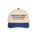 Two-tone Democracy Hat with beige front, blue bill. Embroidered “DEMOCRACY NEEDS YOUR COURAGE” in blue and red, with five