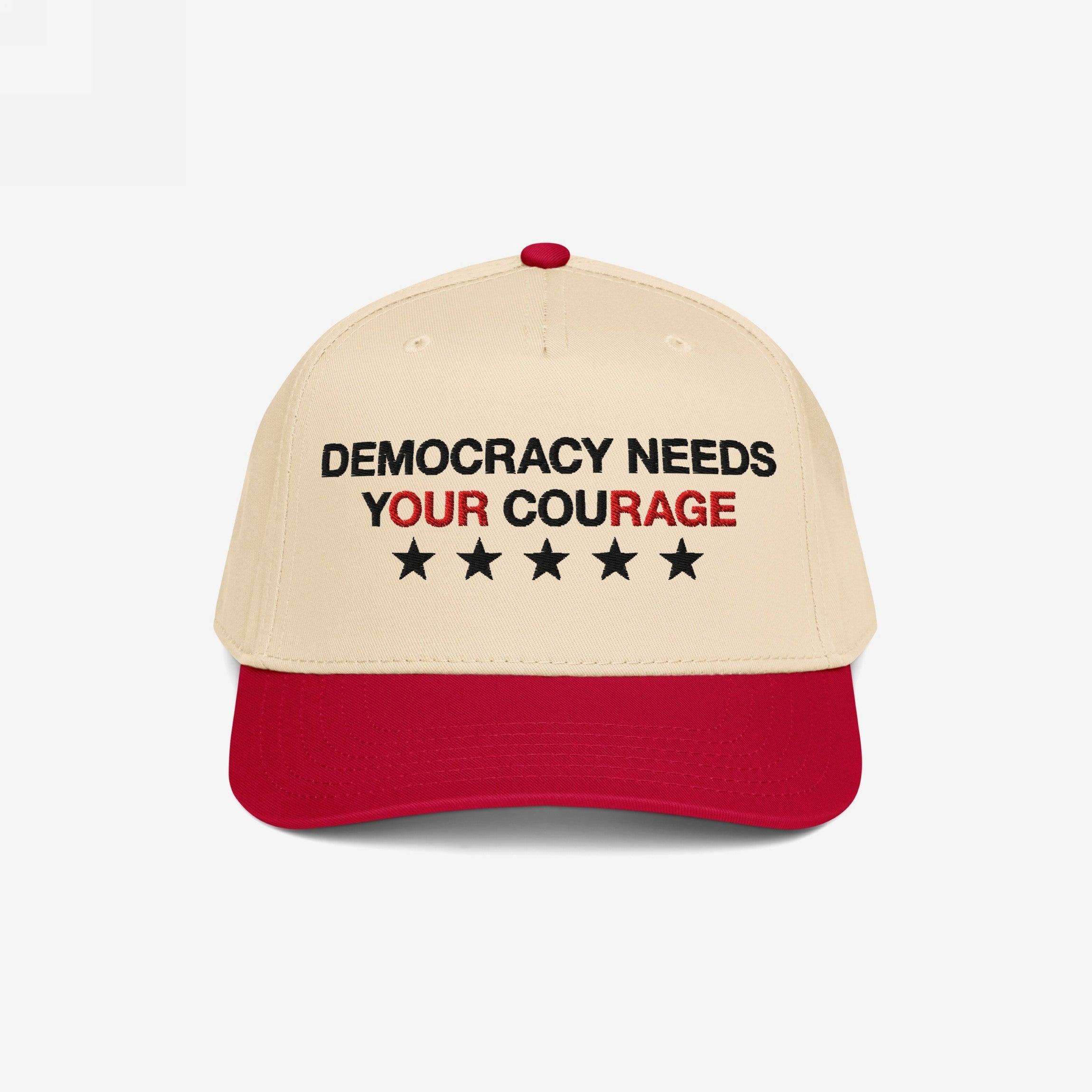 Democracy Hat with a beige crown and red bill, featuring “DEMOCRACY NEEDS YOUR COURAGE” in bold embroidery, ideal for showcasing anti-fascist values and supporting equality.