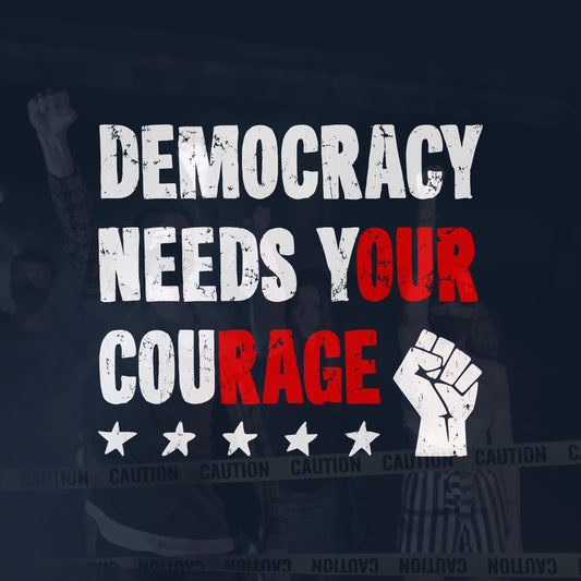 The Democracy Shirt features bold distressed text, Democracy Needs Your Courage, with highlighted words. It includes a raised fist and stars, embodying a motivational protest-style graphic for advocates of equality and resistance.