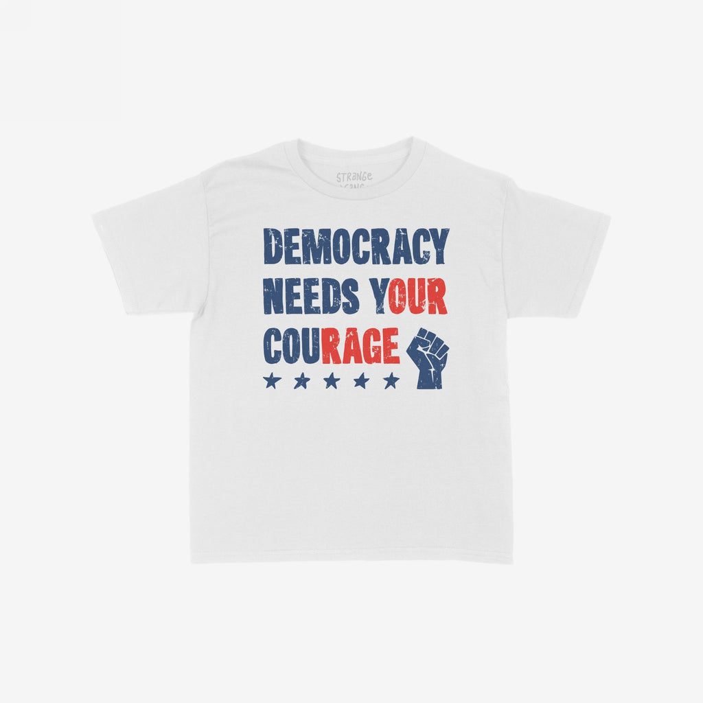 Democracy Women's Baby Tee features a bold, distressed slogan DEMOCRACY NEEDS YOUR COURAGE with a raised fist and five stars, embodying a powerful political message of protest and solidarity.