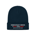 Democracy Hat: A dark-navy ribbed knit beanie featuring “DEMOCRACY NEEDS YOUR COURAGE” embroidered on the cuff, emphasizi