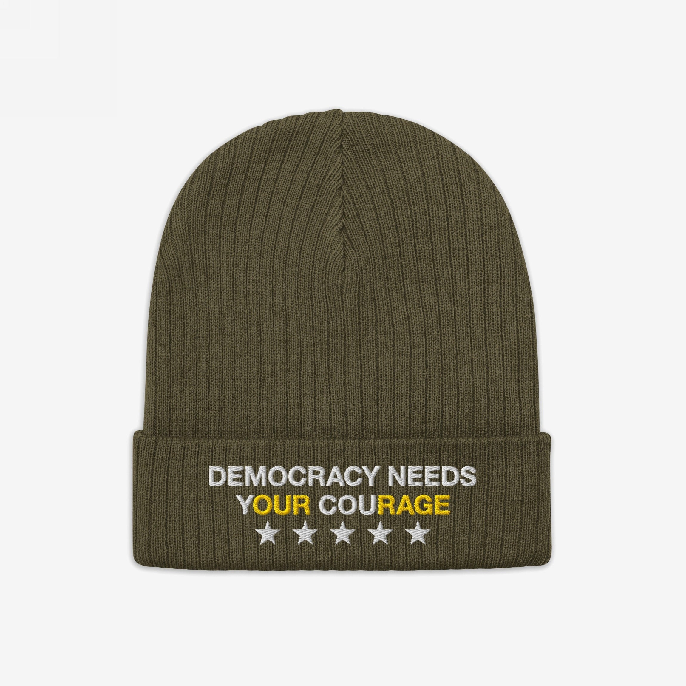 Olive-green knit Democracy Hat with folded cuff, featuring DEMOCRACY NEEDS YOUR COURAGE embroidered in white and yellow, and five aligned stars. Ideal for expressing anti-fascist values and supporting equality.