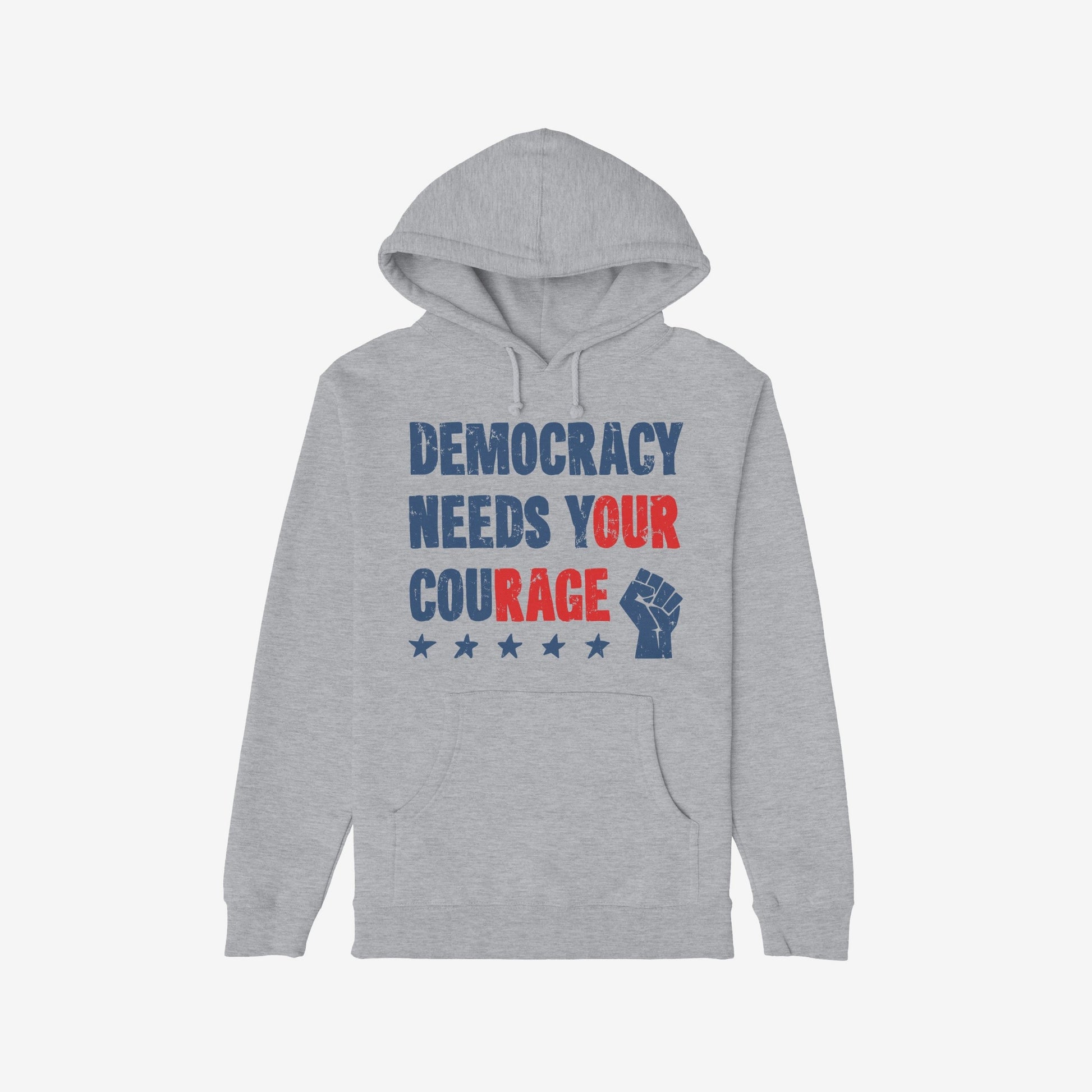 Democracy Shirt: Light-gray hoodie with stencil-style DEMOCRACY NEEDS YOUR COURAGE graphic, featuring distressed stars and raised-fist icon, symbolizing protest energy and resilience. Available in various styles.