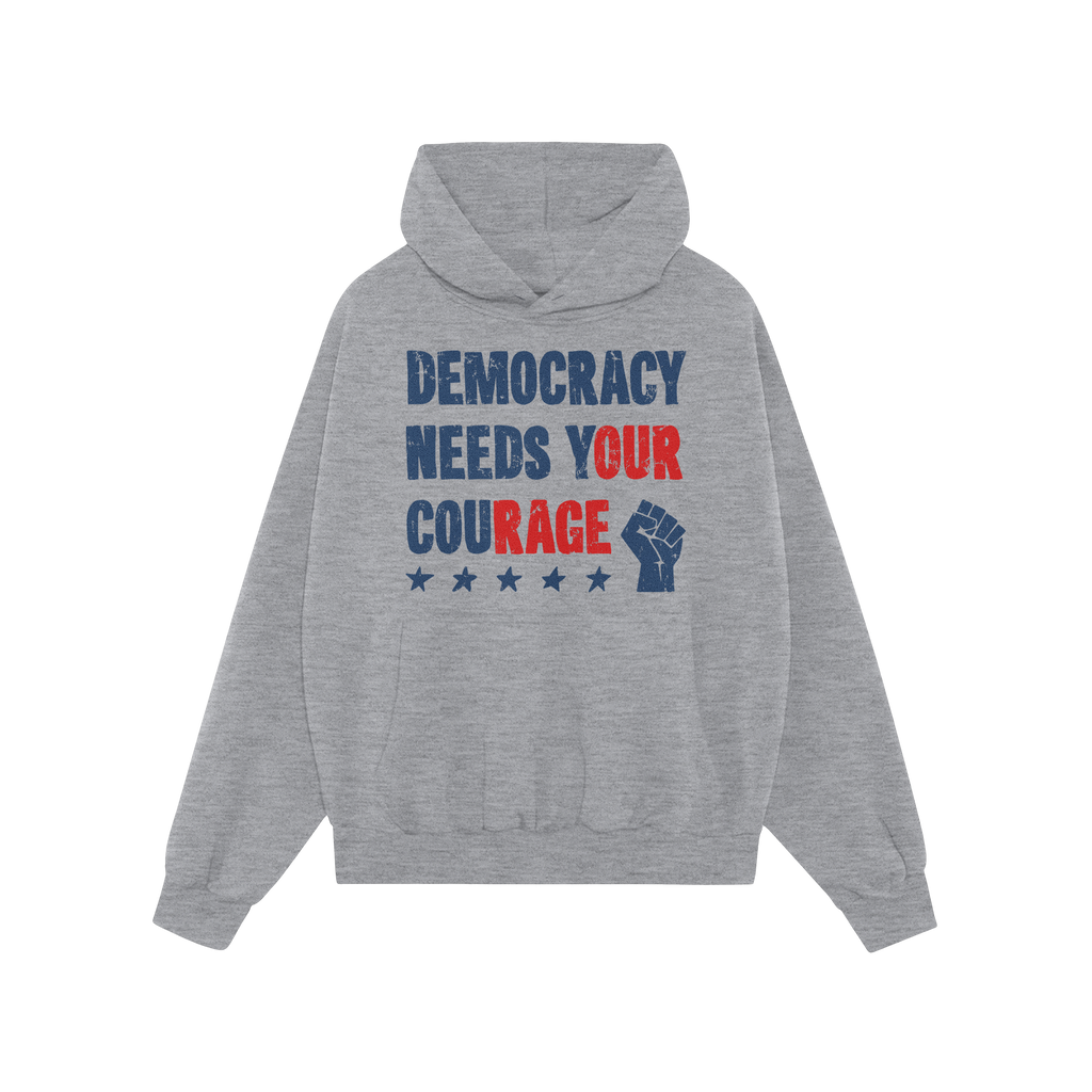 Democracy Shirt: Light-gray hoodie with stencil-style DEMOCRACY NEEDS YOUR COURAGE graphic, featuring distressed stars and ra