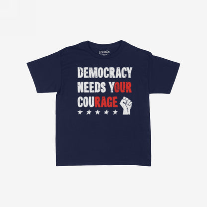 Navy Democracy T-shirt featuring a bold red and white slogan, “DEMOCRACY NEEDS YOUR COURAGE,” with a raised fist icon and stars, embodying a message of resistance and equality.