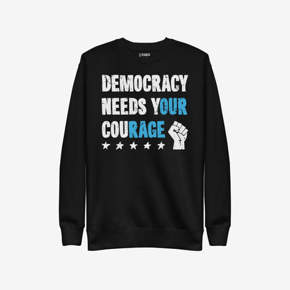 Democracy Hoodie & Sweatshirt with bold, distressed slogan DEMOCRACY NEEDS YOUR COURAGE, featuring highlighted words and protest icons, embodying defiance and solidarity for activism and challenging systems.